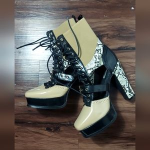 Snakeskin cream heel boots